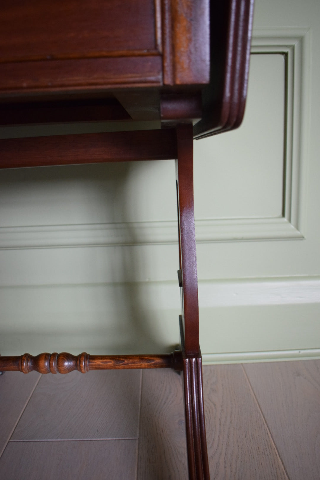 Gorgeous Flamed Mahogany Bedside Or End Wine Tables With green Leather Top on castors