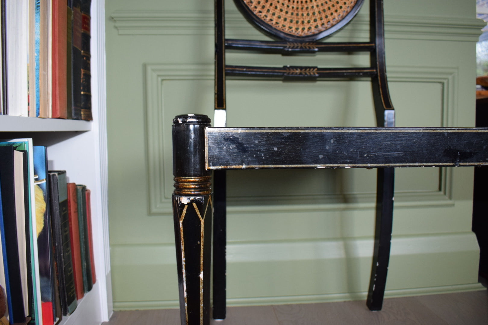 A Regency style black and gilt painted bedroom chair