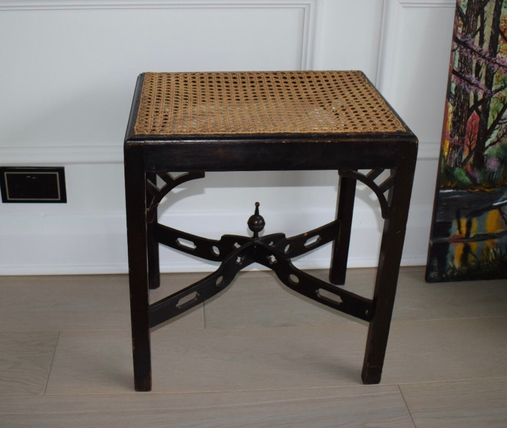 A 1930's Chippendale style stool with woven cane seat