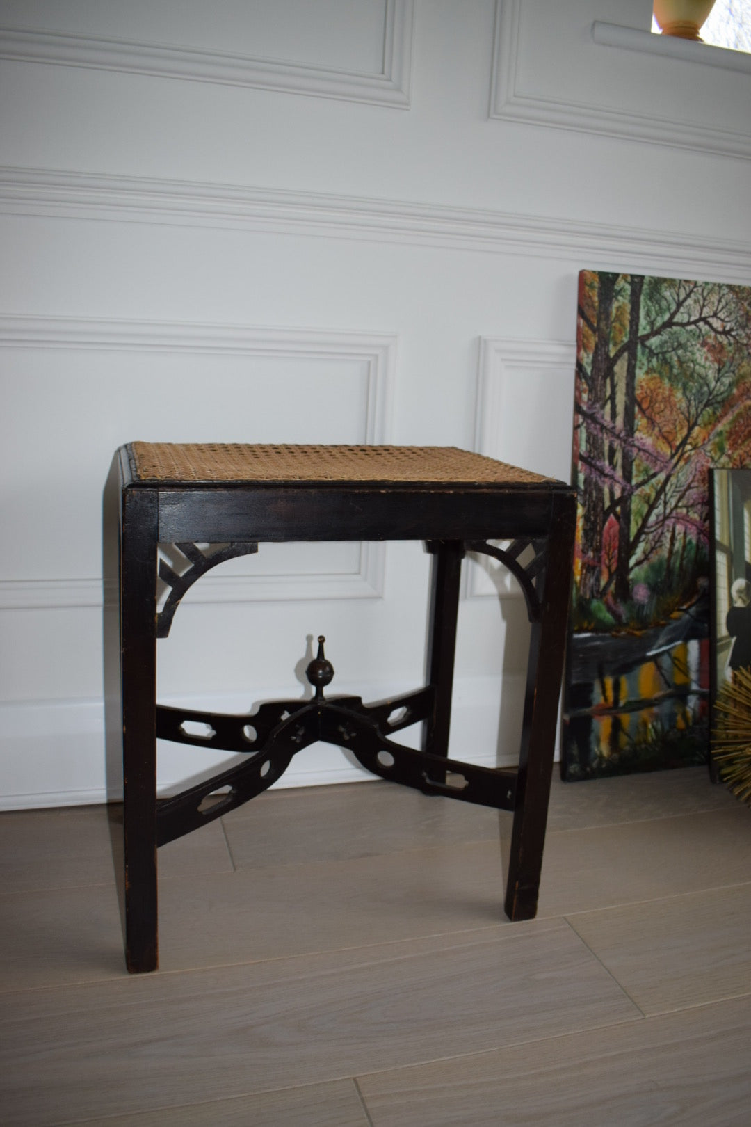 A 1930's Chippendale style stool with woven cane seat