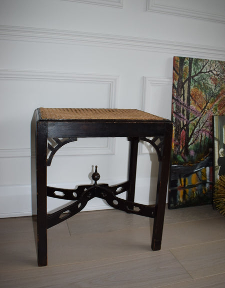 A 1930's Chippendale style stool with woven cane seat